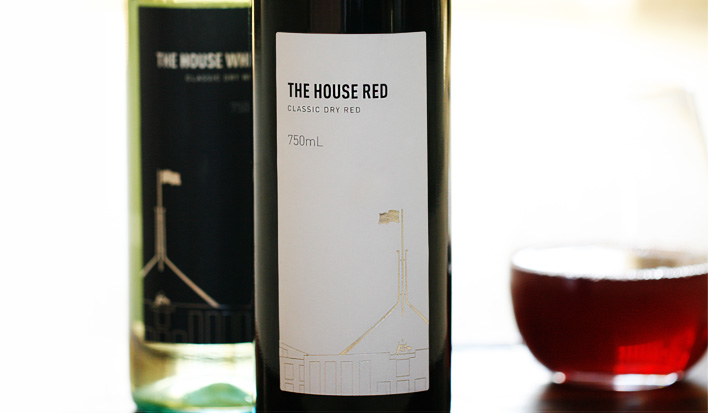 Bottles of the House White and the House Red with silver embossed foil on the label.